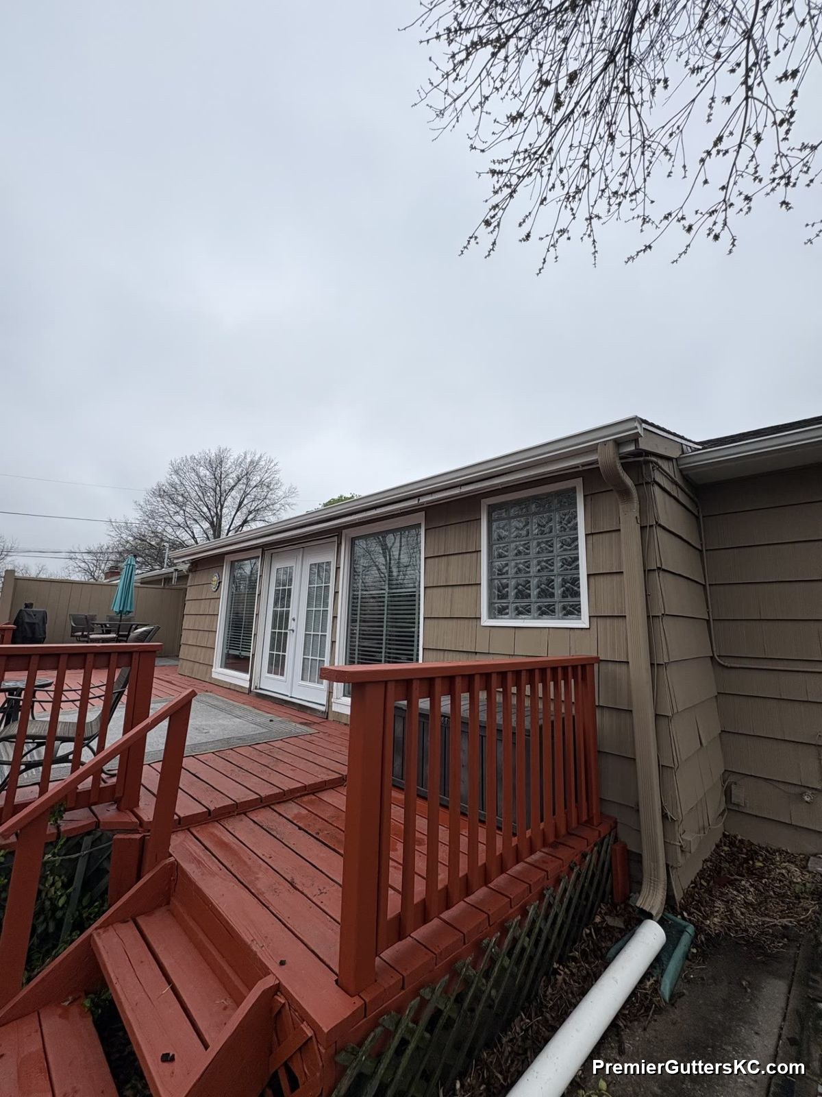 Downspout with extension on KC bungalow with back deck