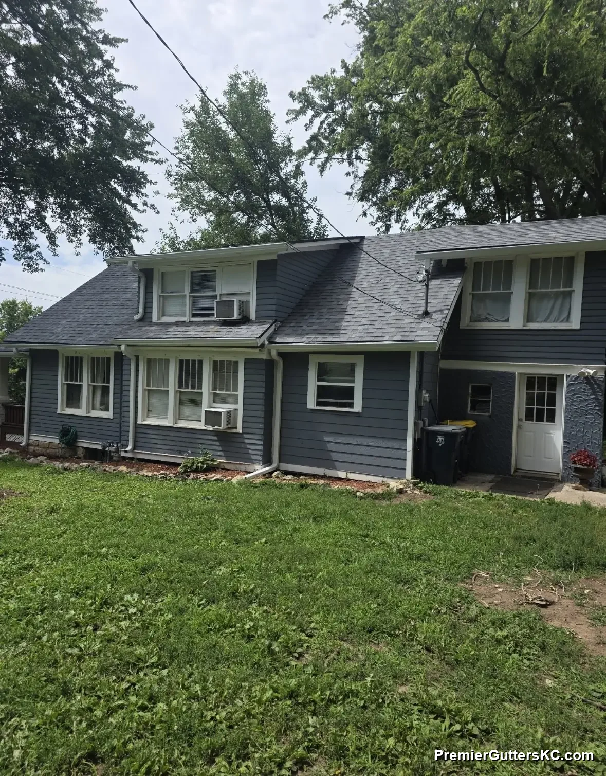 White seamless gutters on a two-story Overland Park, KS home